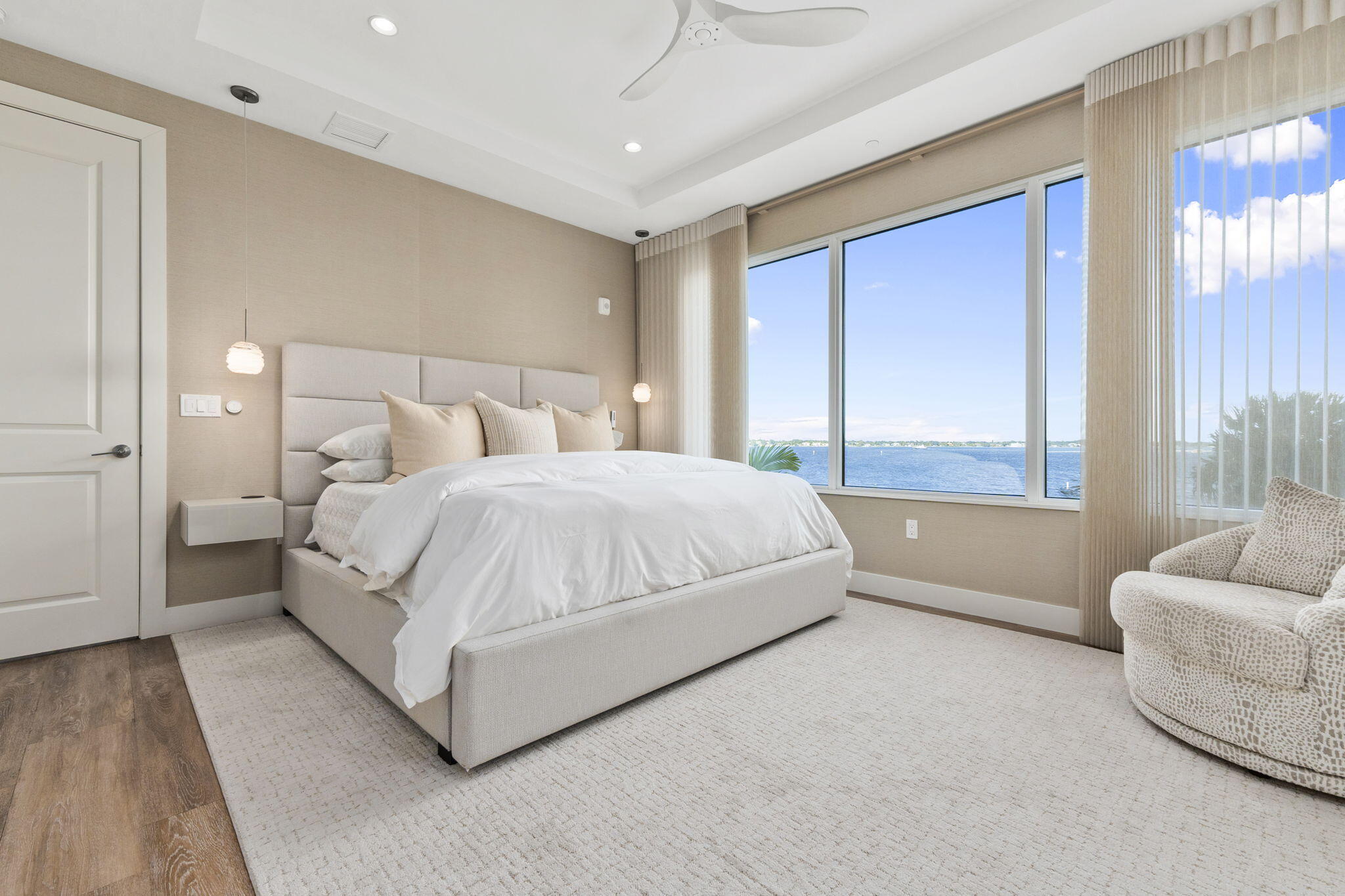 41 Southwest Seminole Street, Unit 206 Stuart, FL 34994 - Photo 34 of 72 a bedroom with a bed and glass window