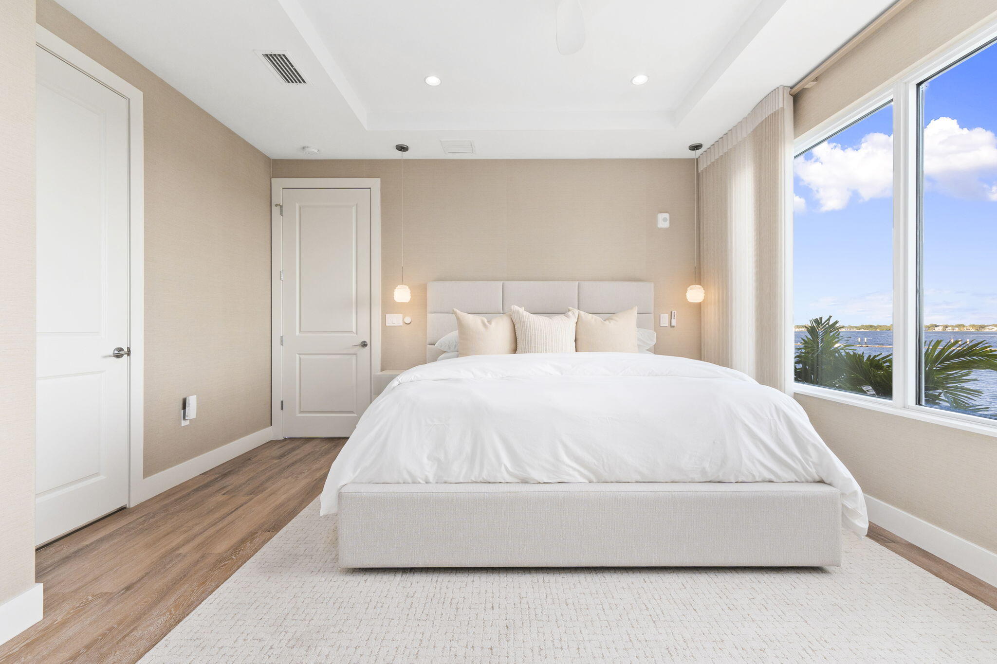 41 Southwest Seminole Street, Unit 206 Stuart, FL 34994 - Photo 35 of 72 a bed sitting in a spacious bedroom next to a window