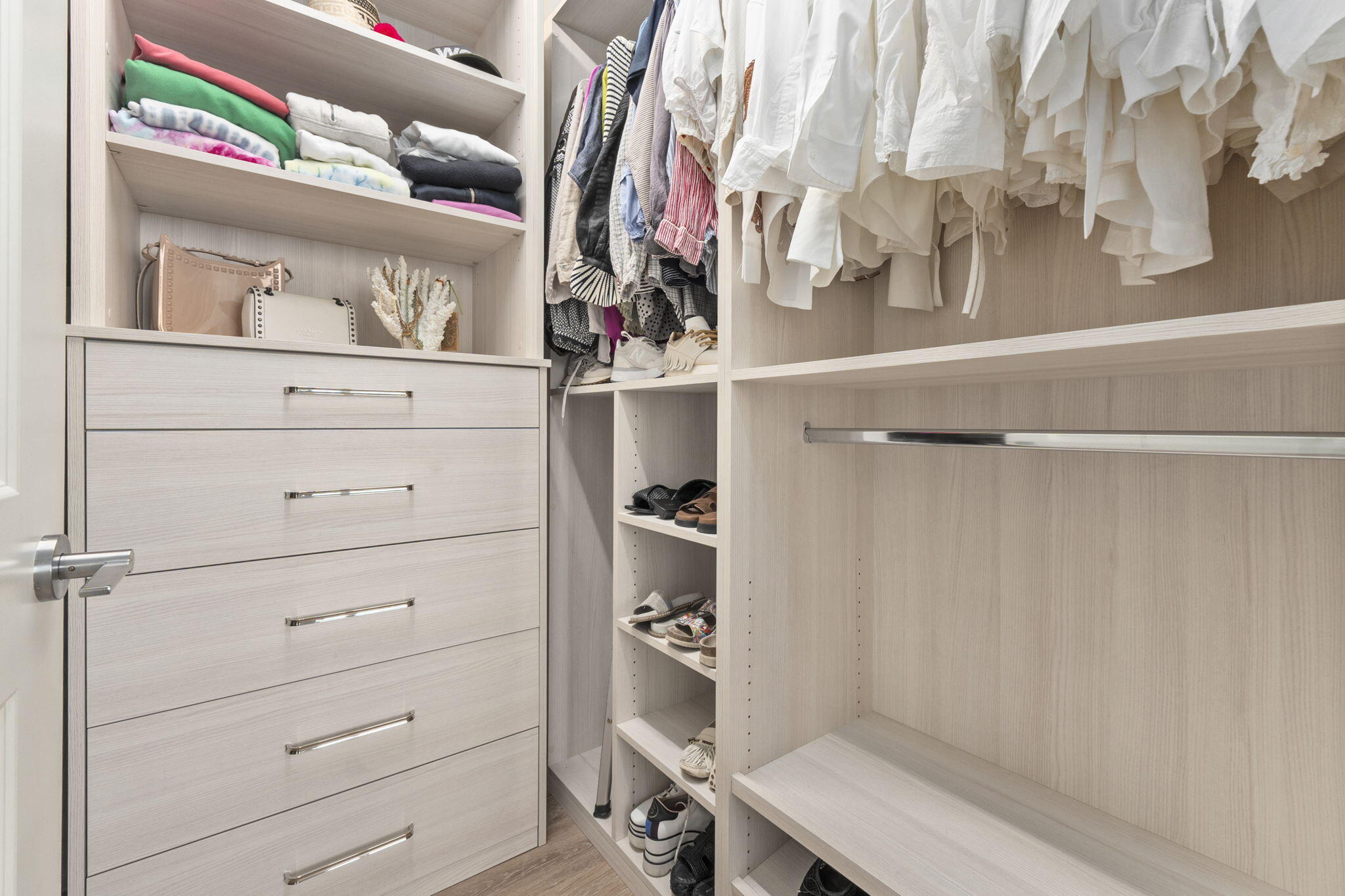 41 Southwest Seminole Street, Unit 206 Stuart, FL 34994 - Photo 39 of 72 a view of walk in closet with clothes and shoes