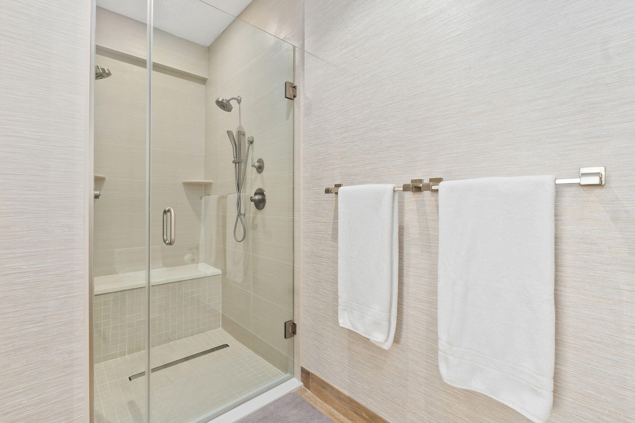 41 Southwest Seminole Street, Unit 206 Stuart, FL 34994 - Photo 42 of 72 a bathroom with a shower and a glass door