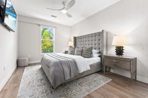 a front view of a house with outdoor seating