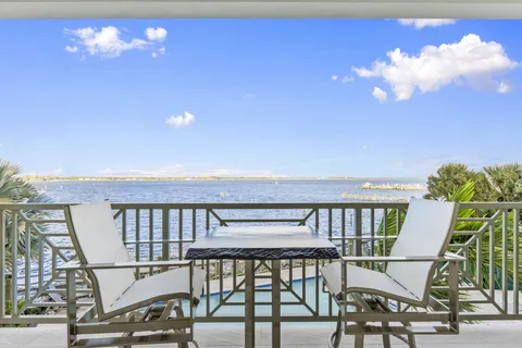 a view of a swimming pool with outdoor seating