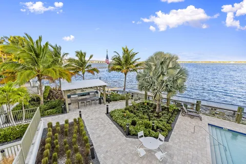 a view of a swimming pool with sitting area