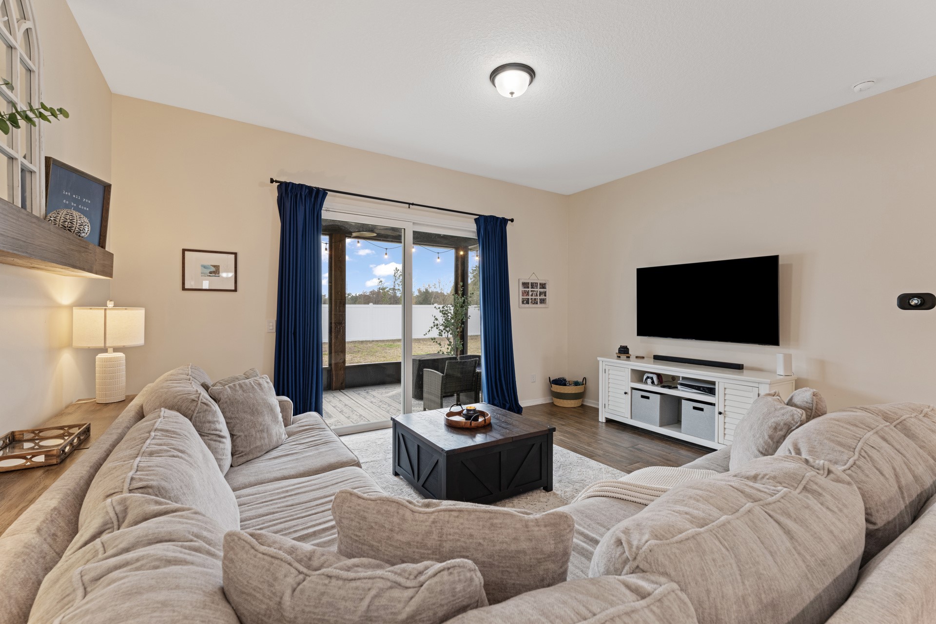 86645 Lazy Lake Circle Yulee, FL 32097 - Photo 16 of 44 a living room with furniture and a flat screen tv