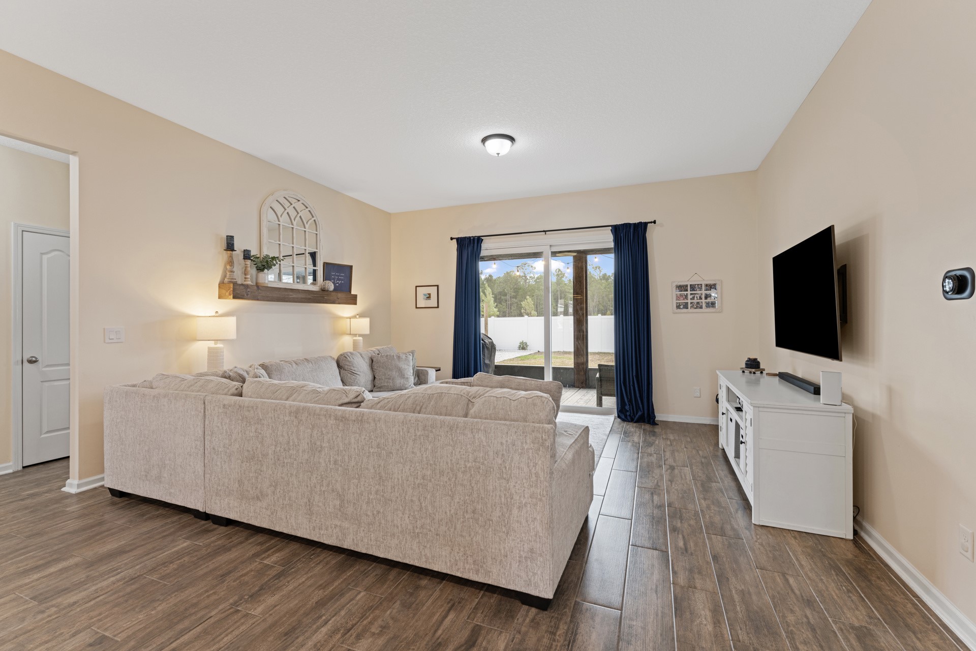 86645 Lazy Lake Circle Yulee, FL 32097 - Photo 18 of 44 a living room with furniture and a flat screen tv
