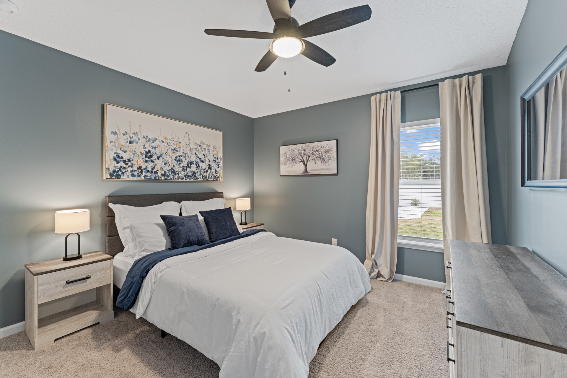 86645 Lazy Lake Circle Yulee, FL 32097 - Photo 23 of 44 a bedroom with a bed and a painting on the wall