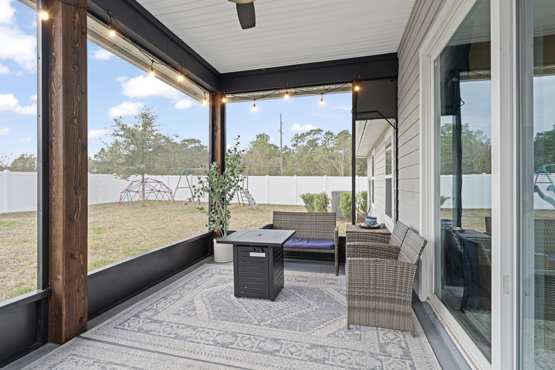 86645 Lazy Lake Circle Yulee, FL 32097 - Photo 29 of 44 a living room with large windows and furniture