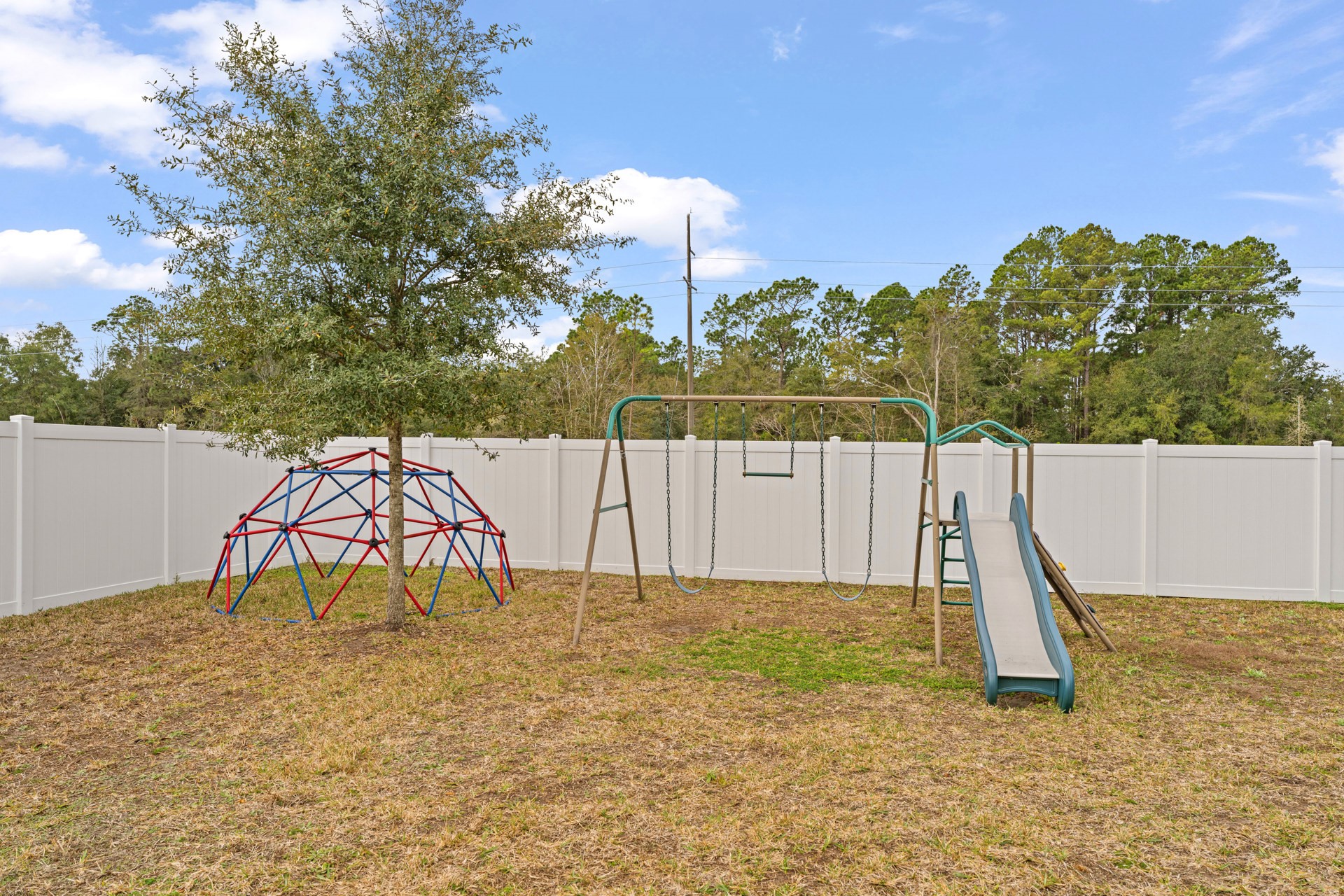 86645 Lazy Lake Circle Yulee, FL 32097 - Photo 36 of 44 a view of a swimming pool with a slide