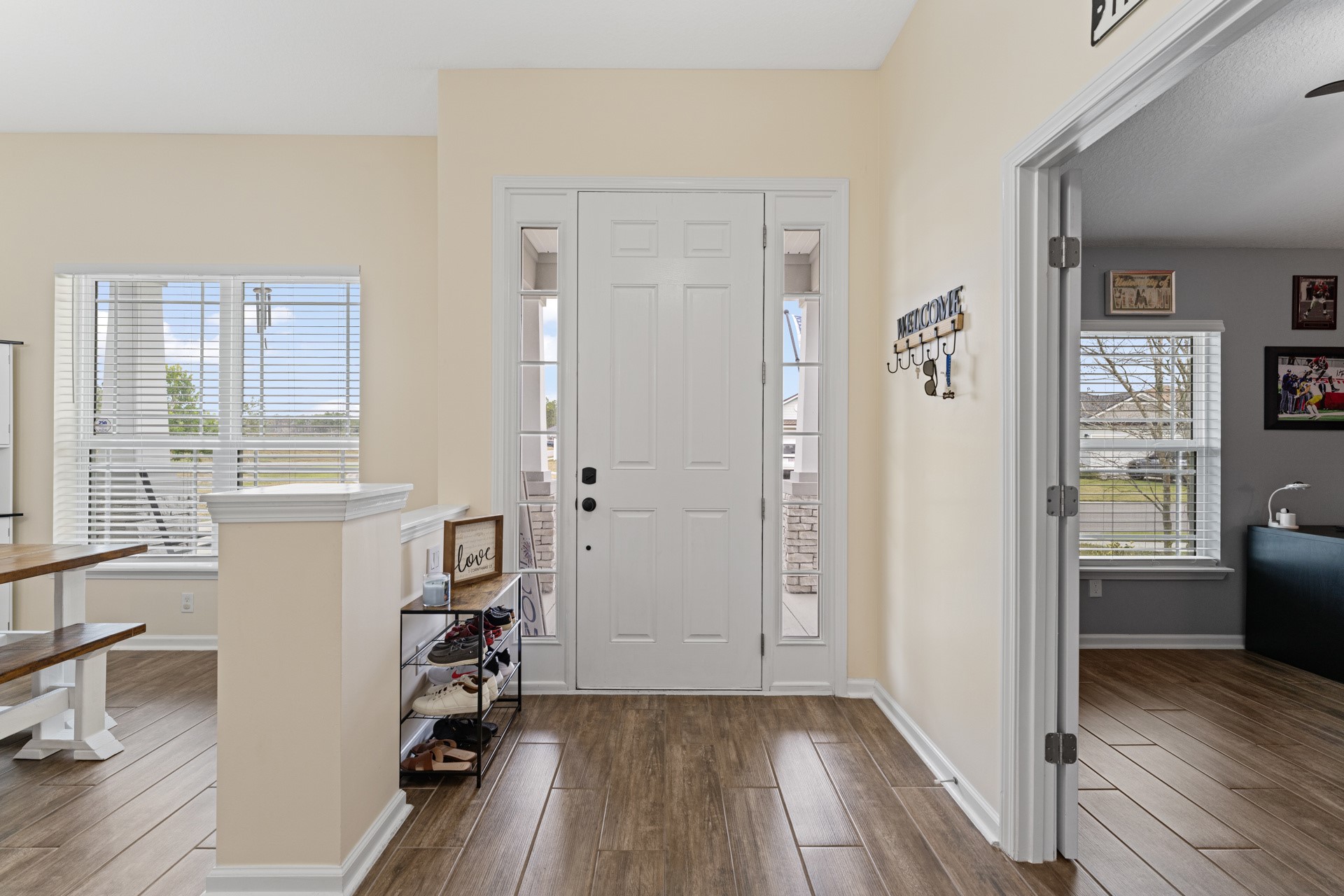 86645 Lazy Lake Circle Yulee, FL 32097 - Photo 4 of 44 wooden floor in an empty room with a window