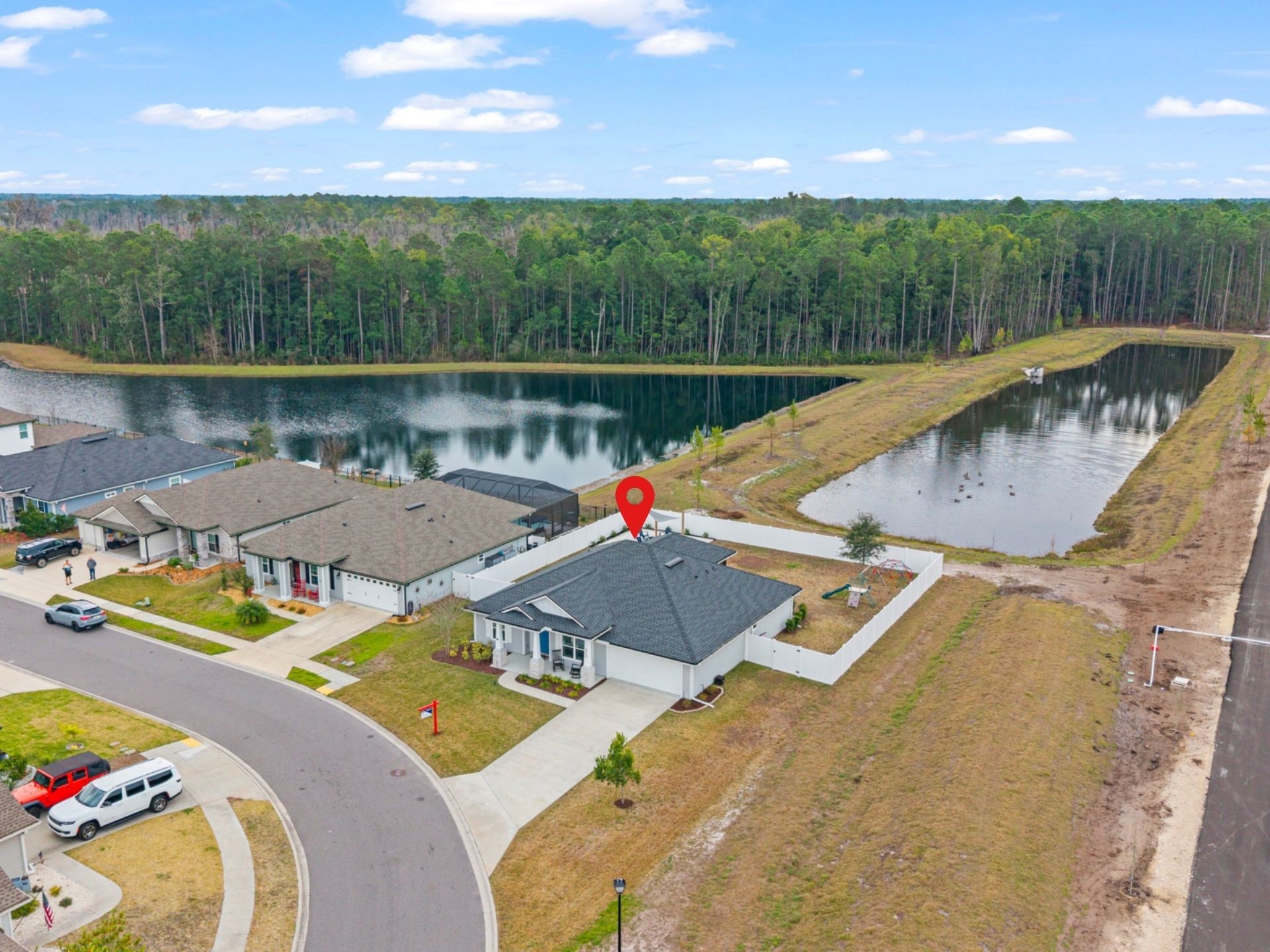 86645 Lazy Lake Circle Yulee, FL 32097 - Photo 43 of 44 a view of a swimming pool with a patio and a yard