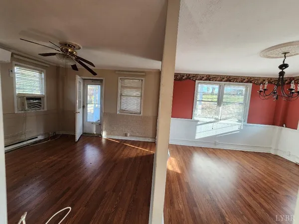 a view of hallway with wooden floor
