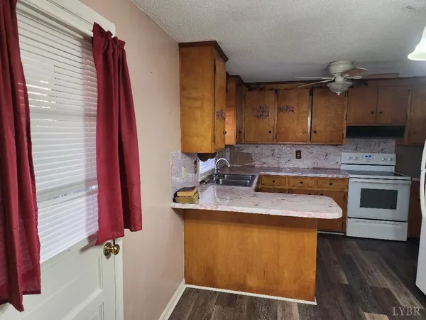a kitchen with a sink cabinets and stainless steel appliances