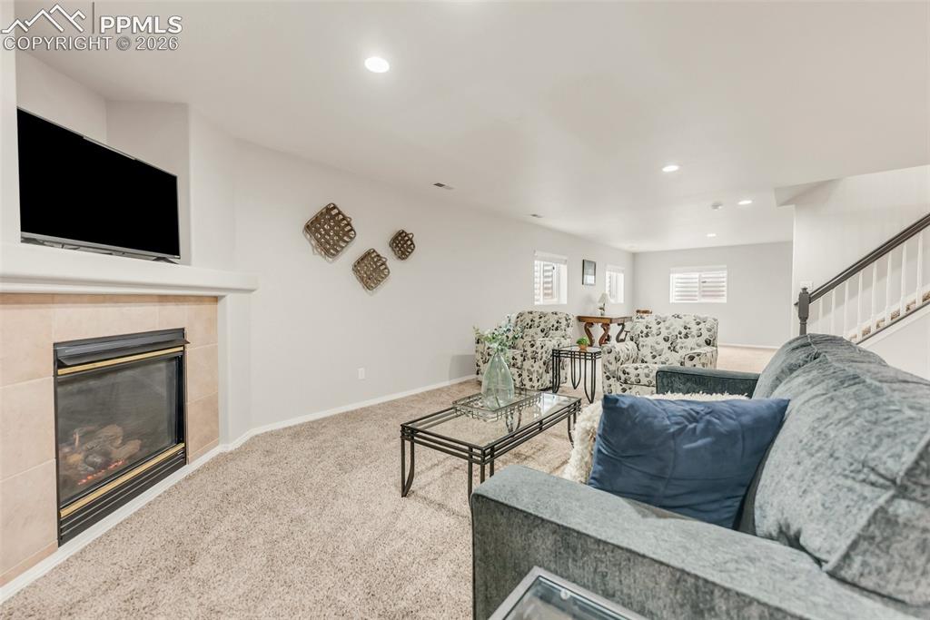 10467 Pictured Rocks Drive Peyton, CO 80831 - Photo 28 of 42 Basement Family Room with second gas fireplace