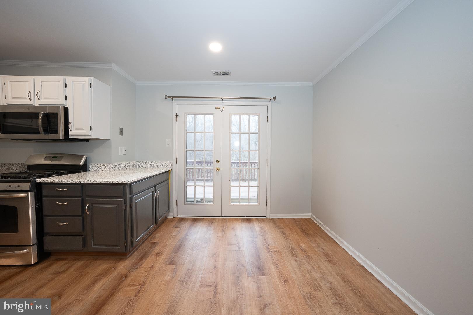 26 Rampart Drive Chesterbrook, PA 19087 - Photo 10 of 39 Dining Area adjacent Kitchen wFrench Doors to Deck