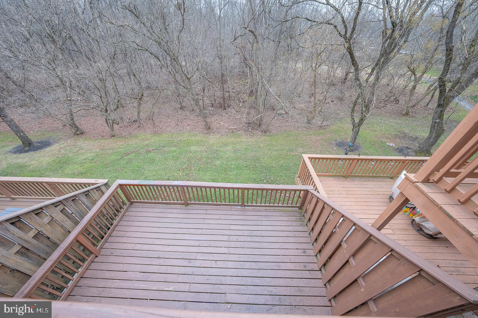 26 Rampart Drive Chesterbrook, PA 19087 - Photo 18 of 39 View of Lower Deck and Woods from Primary Balcony