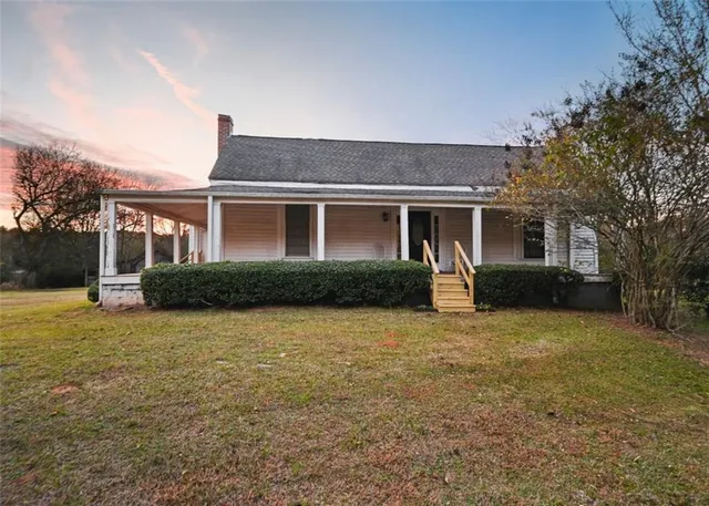 a front view of a house with yard