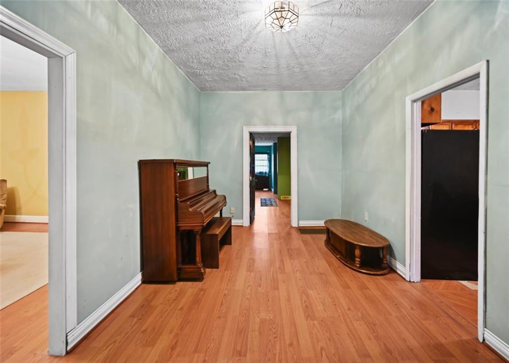 4000 Bostwick Road Madison, GA 30650 - Photo 24 of 34 a bedroom with a bed and wooden floor