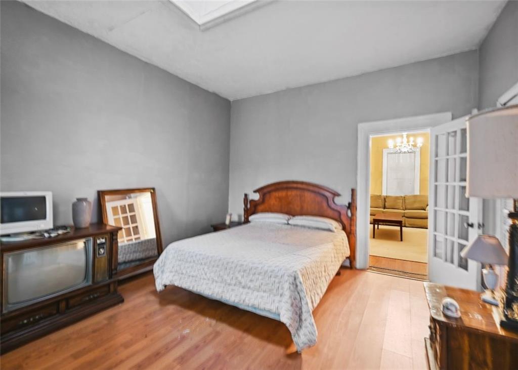 4000 Bostwick Road Madison, GA 30650 - Photo 25 of 34 a bedroom with a bed and a flat screen tv