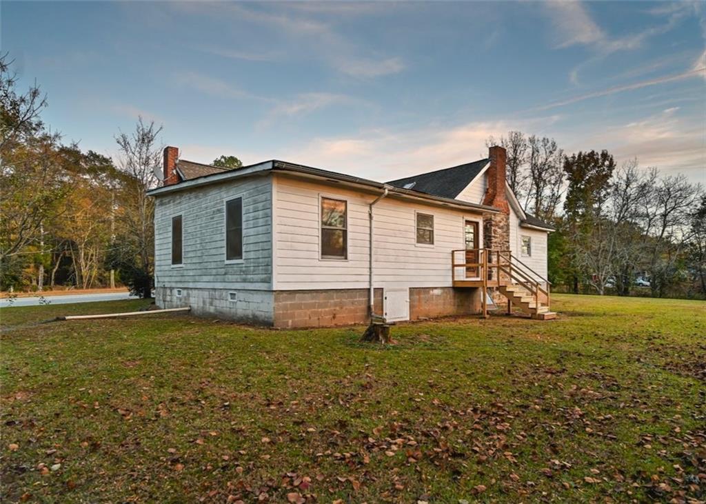 4000 Bostwick Road Madison, GA 30650 - Photo 30 of 34 a view of a house with a yard