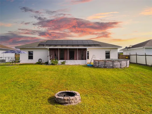 swimming pool view with a garden and plants