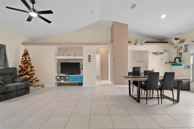 a living room with furniture and large window