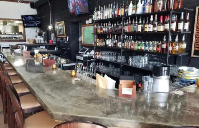 a view of a chairs and tables in patio