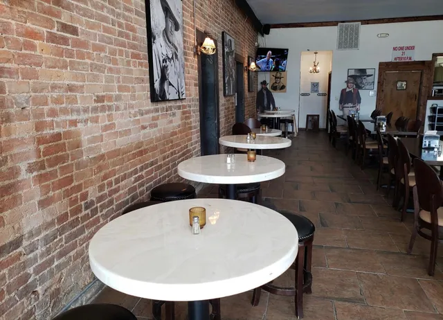 a bathroom with a sink a mirror and shower