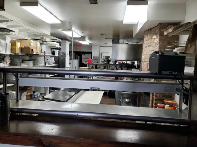 a kitchen with a stove and cabinets