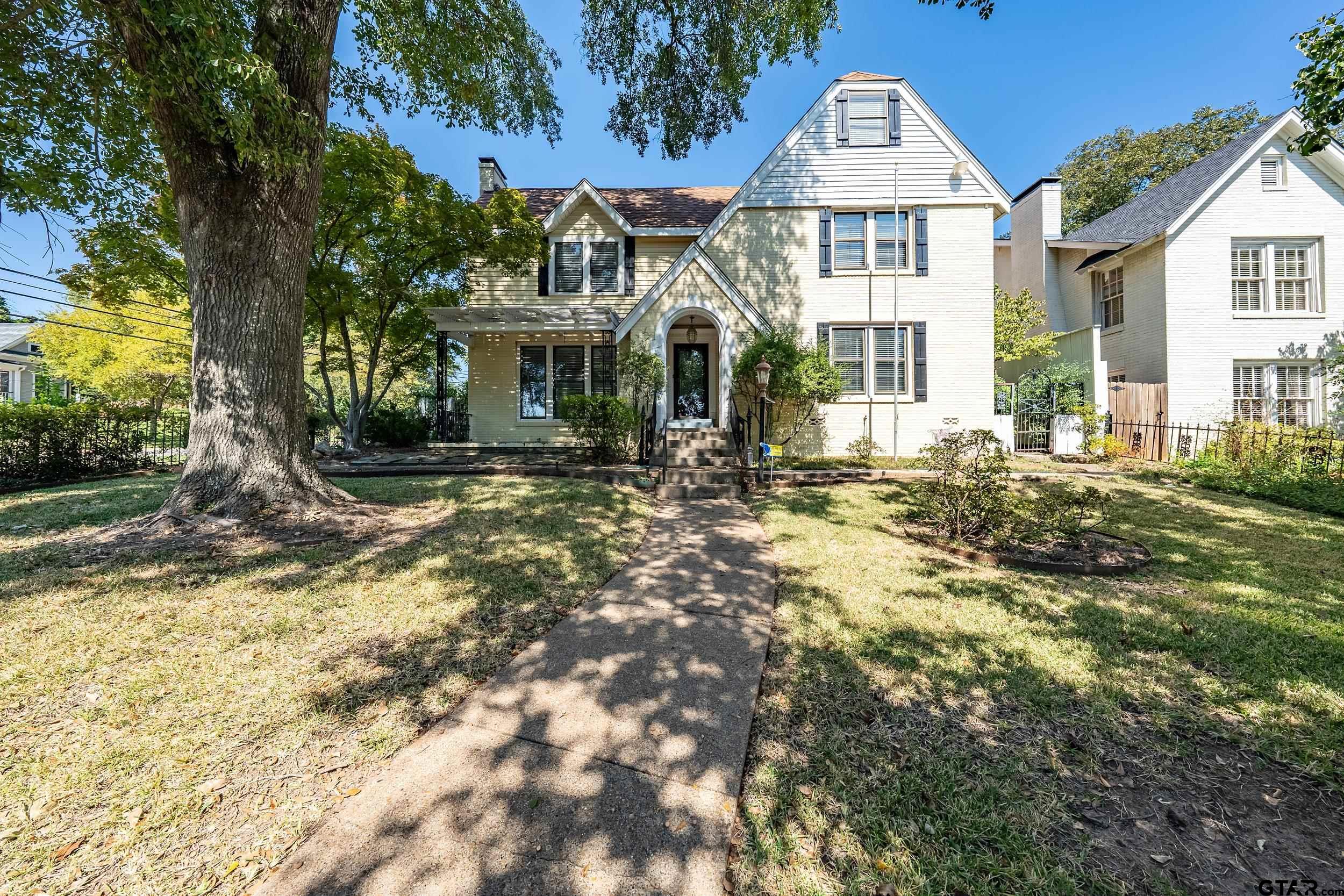 145 Rowland Place Tyler, TX 75701 - Photo 8 of 43 a front view of a house with a yard