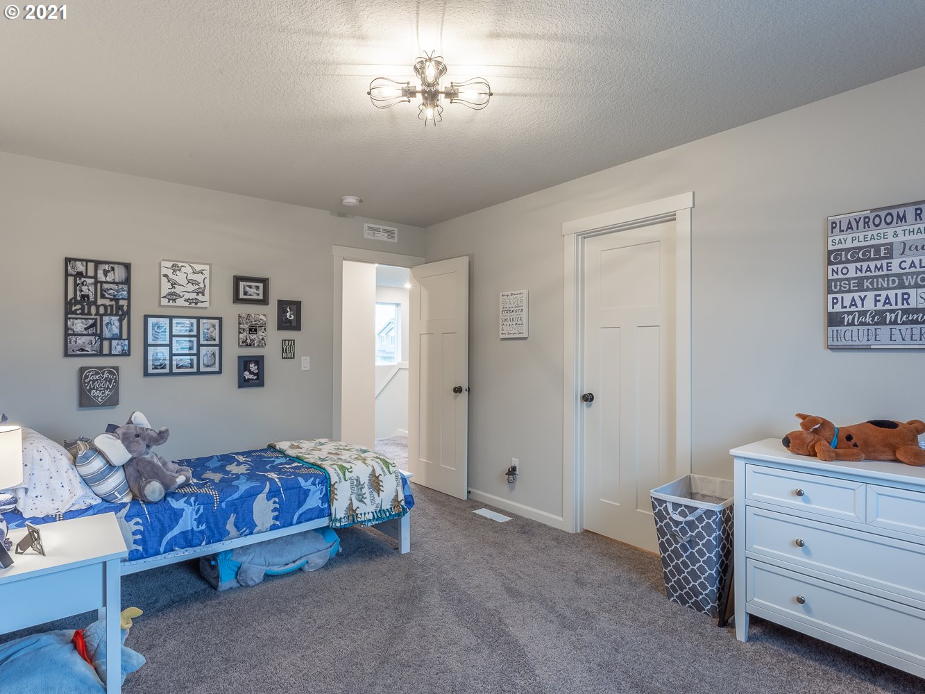 3803 South Star View Loop Ridgefield, WA 98642 - Photo 22 of 32 a bedroom with furniture and a chandelier