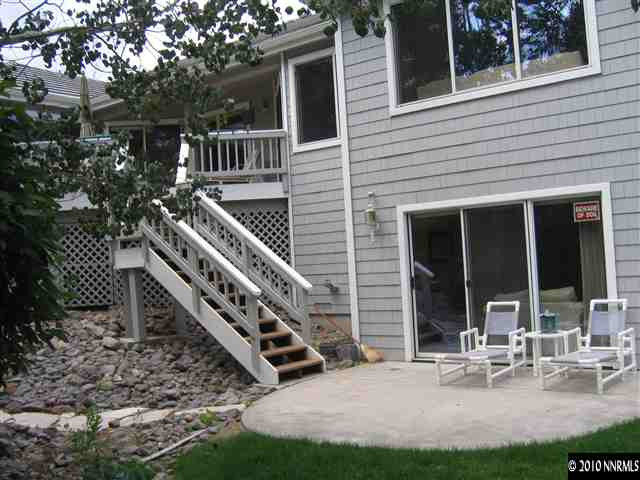 4390 Bitteroot Road Reno, NV 89519 - Photo 2 of 9 a view of a house with backyard and sitting area