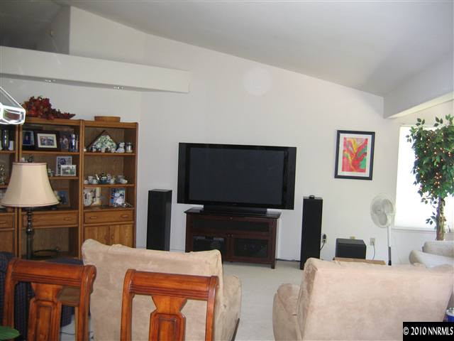 4390 Bitteroot Road Reno, NV 89519 - Photo 5 of 9 a living room with furniture and a flat screen tv