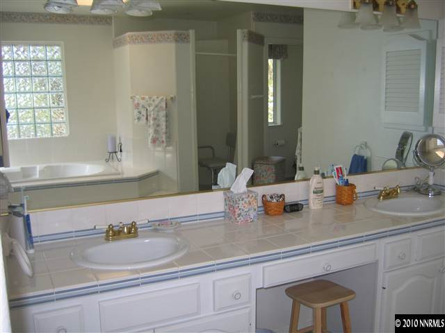 4390 Bitteroot Road Reno, NV 89519 - Photo 9 of 9 a bathroom with sink and a mirror