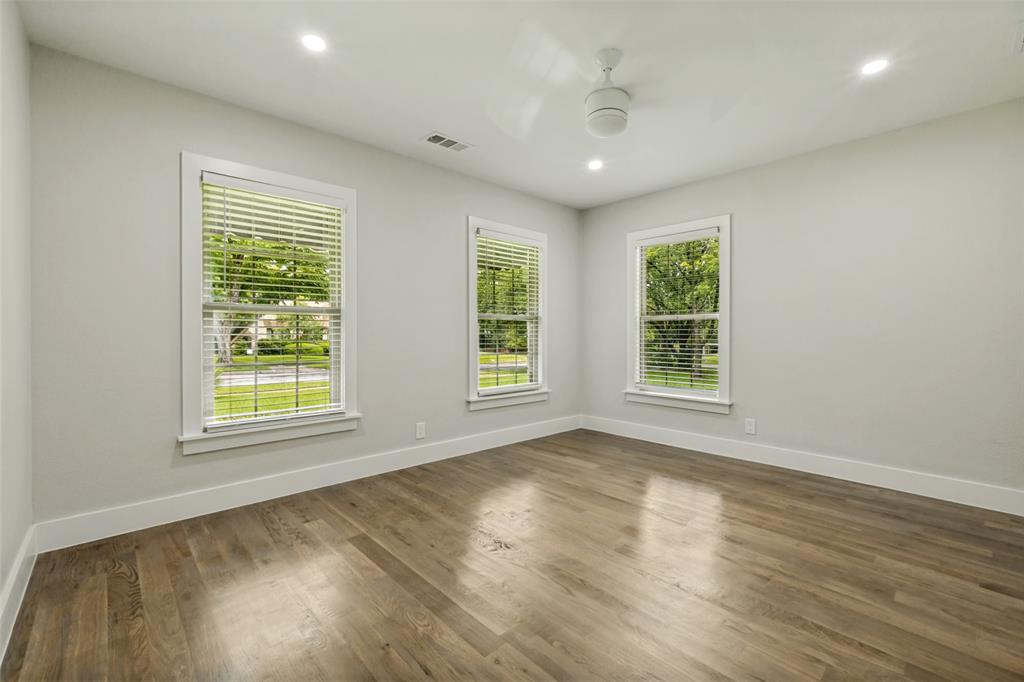 2006 Marydale Road Dallas, TX 75208 - Photo 29 of 40 Hardwood-style flooring throughout a room with light-colored walls and white trim
