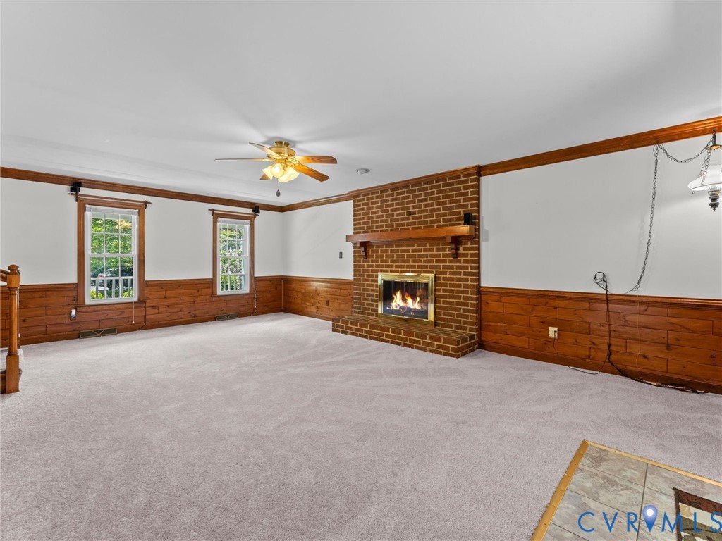 3524 Ludgate Road Chester, VA 23831 - Photo 12 of 44 Spacious room featuring a brick fireplace with a w