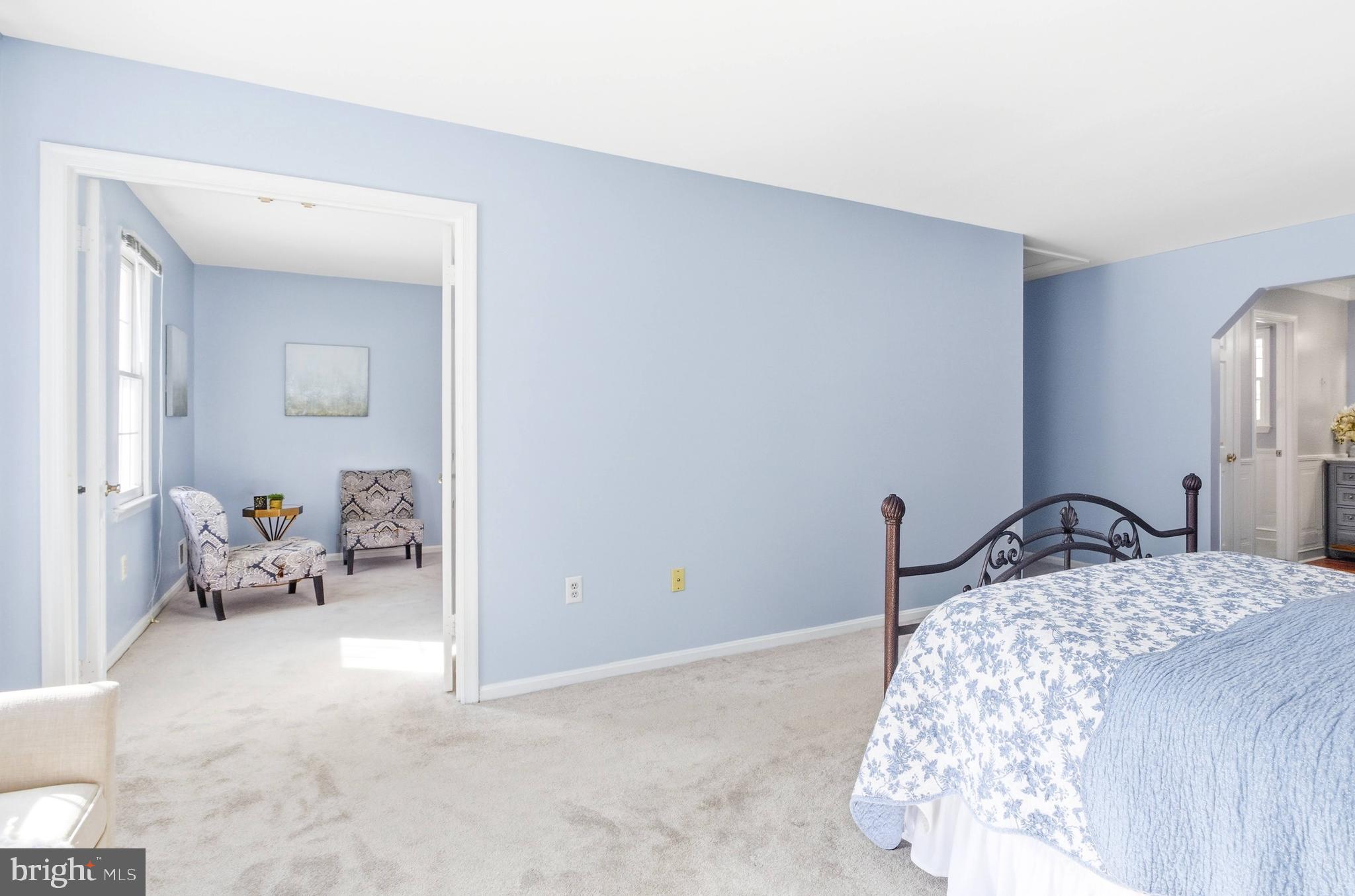 11316 Robert Carter Road Fairfax Station, VA 22039 - Photo 11 of 56 a bedroom with a bed and a mirror