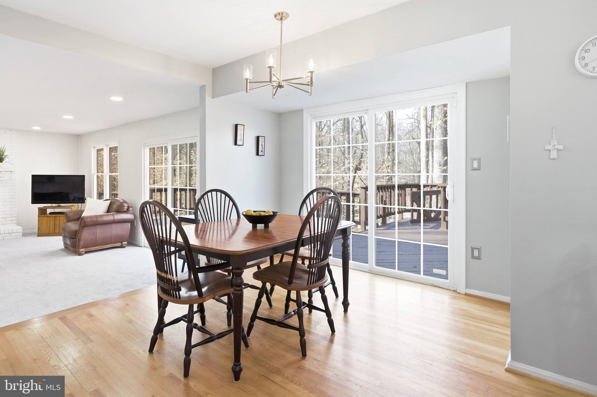 11316 Robert Carter Road Fairfax Station, VA 22039 - Photo 14 of 56 a view of a dining room with furniture window and wooden floor