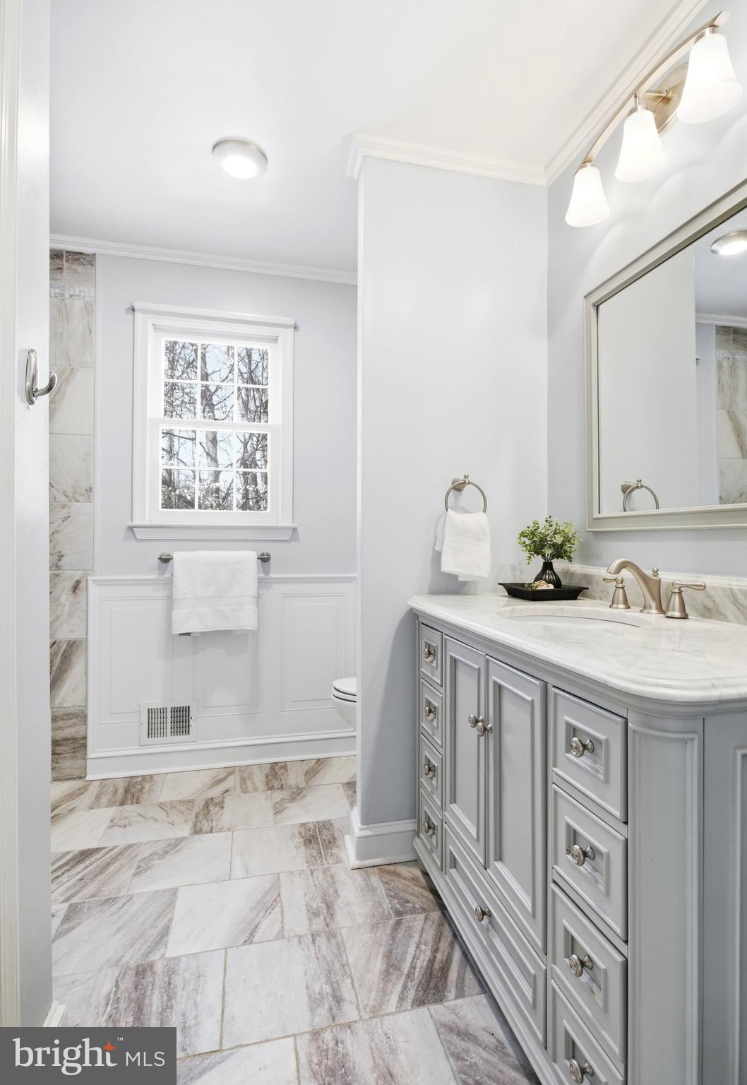 11316 Robert Carter Road Fairfax Station, VA 22039 - Photo 20 of 56 a spacious bathroom with a double vanity sink a mirror and a bathtub