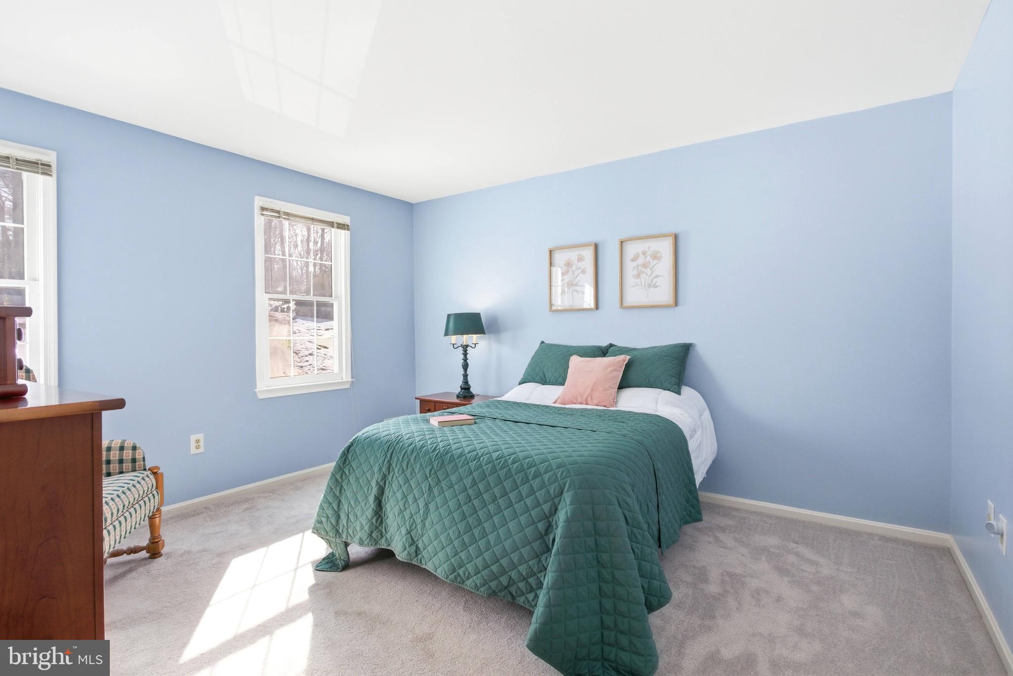 11316 Robert Carter Road Fairfax Station, VA 22039 - Photo 22 of 56 a bedroom with a bed and a window