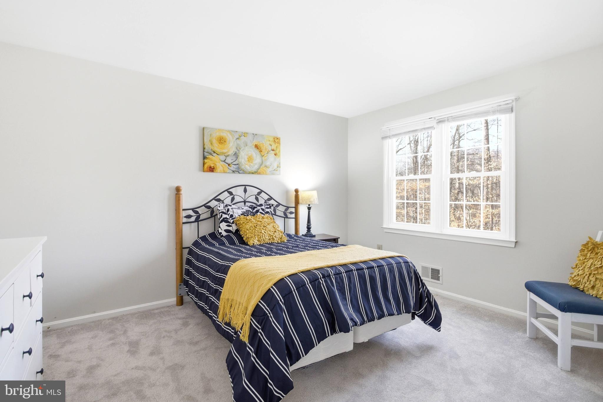 11316 Robert Carter Road Fairfax Station, VA 22039 - Photo 23 of 56 a bedroom with a bed and a window