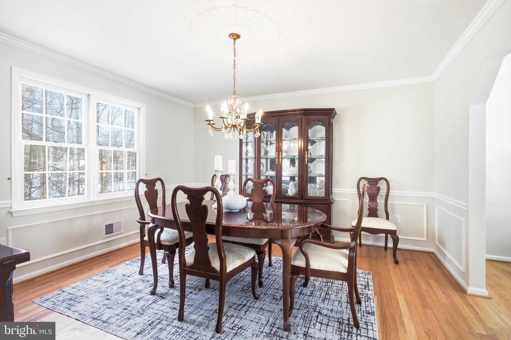 11316 Robert Carter Road Fairfax Station, VA 22039 - Photo 27 of 56 a view of a dining room with furniture window and wooden floor