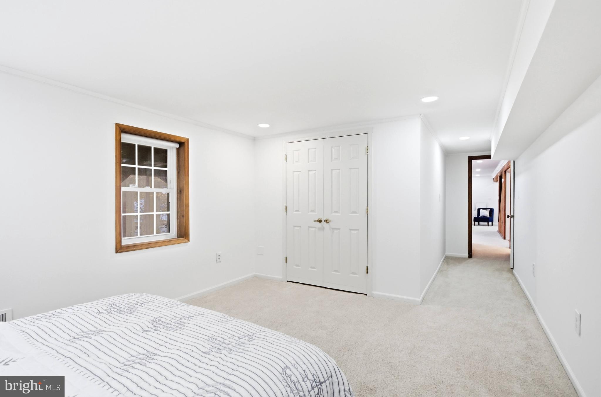 11316 Robert Carter Road Fairfax Station, VA 22039 - Photo 36 of 56 a bedroom with a bed and a window