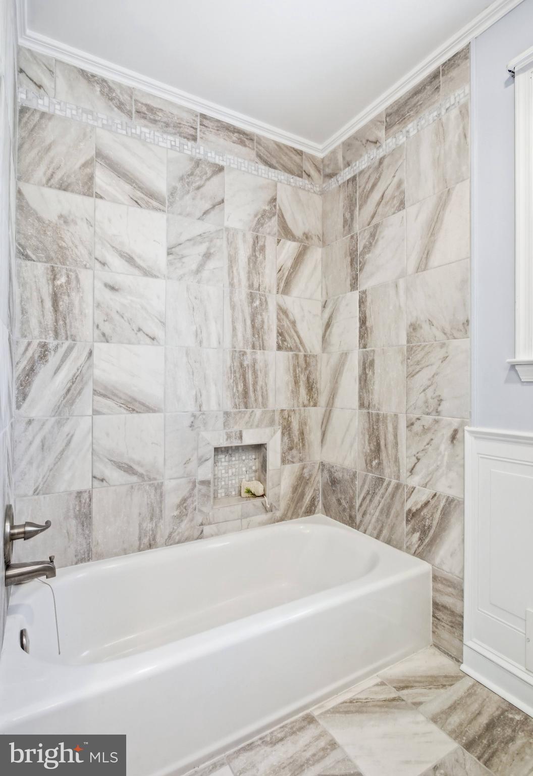 11316 Robert Carter Road Fairfax Station, VA 22039 - Photo 37 of 56 a bathroom with a shower and a bath tub