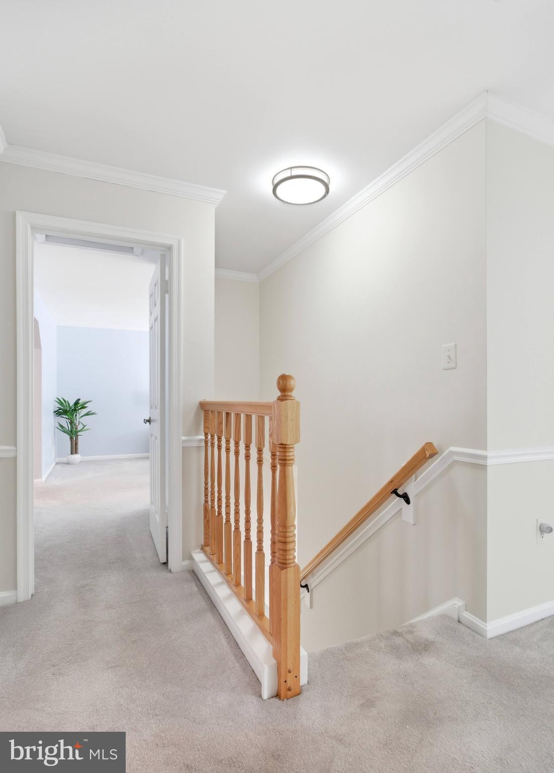 11316 Robert Carter Road Fairfax Station, VA 22039 - Photo 38 of 56 a view of a hallway to a room with stair