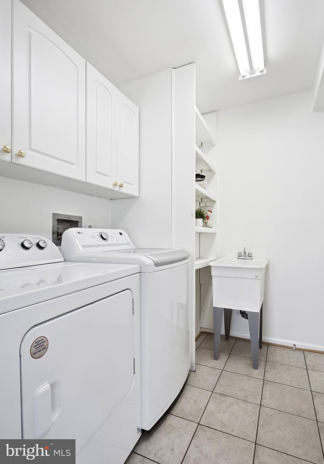 11316 Robert Carter Road Fairfax Station, VA 22039 - Photo 44 of 56 a utility room with closet dryer and washer