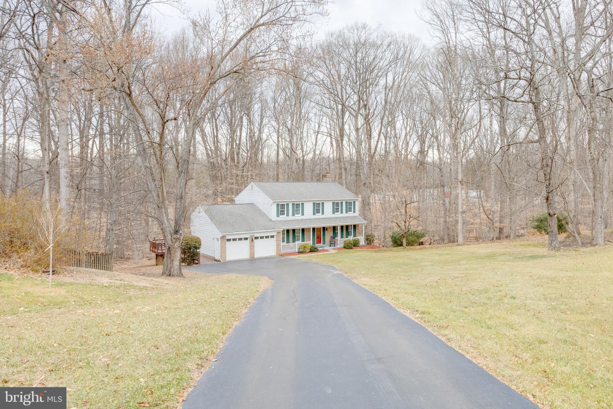 11316 Robert Carter Road Fairfax Station, VA 22039 - Photo 45 of 56 a view of an house with backyard and trees
