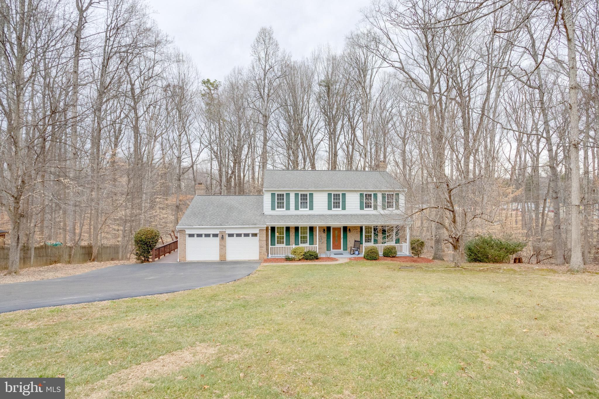 11316 Robert Carter Road Fairfax Station, VA 22039 - Photo 46 of 56 a view of a house with a yard and sitting area