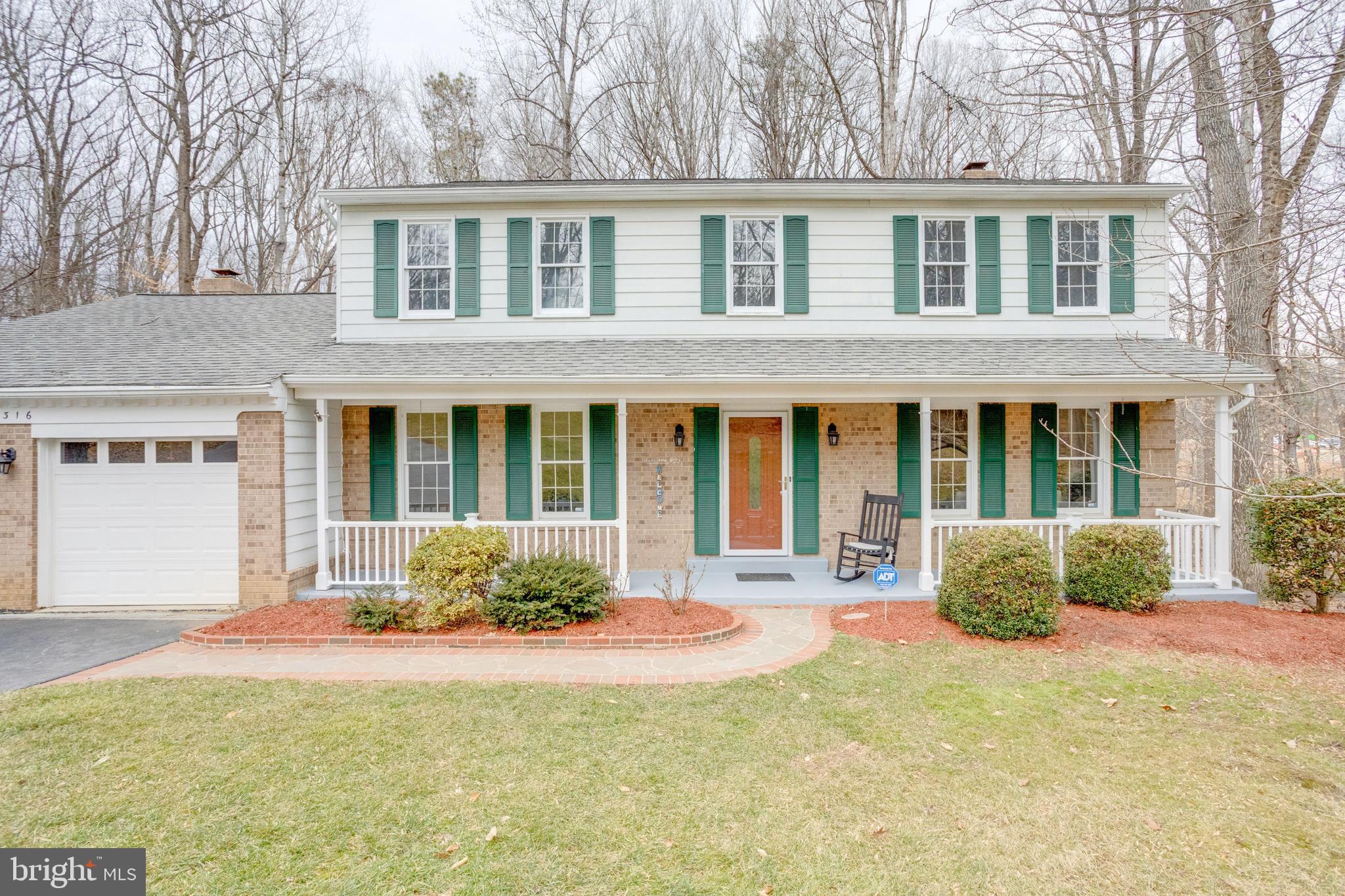 11316 Robert Carter Road Fairfax Station, VA 22039 - Photo 48 of 56 a house view with a sitting space and garden space
