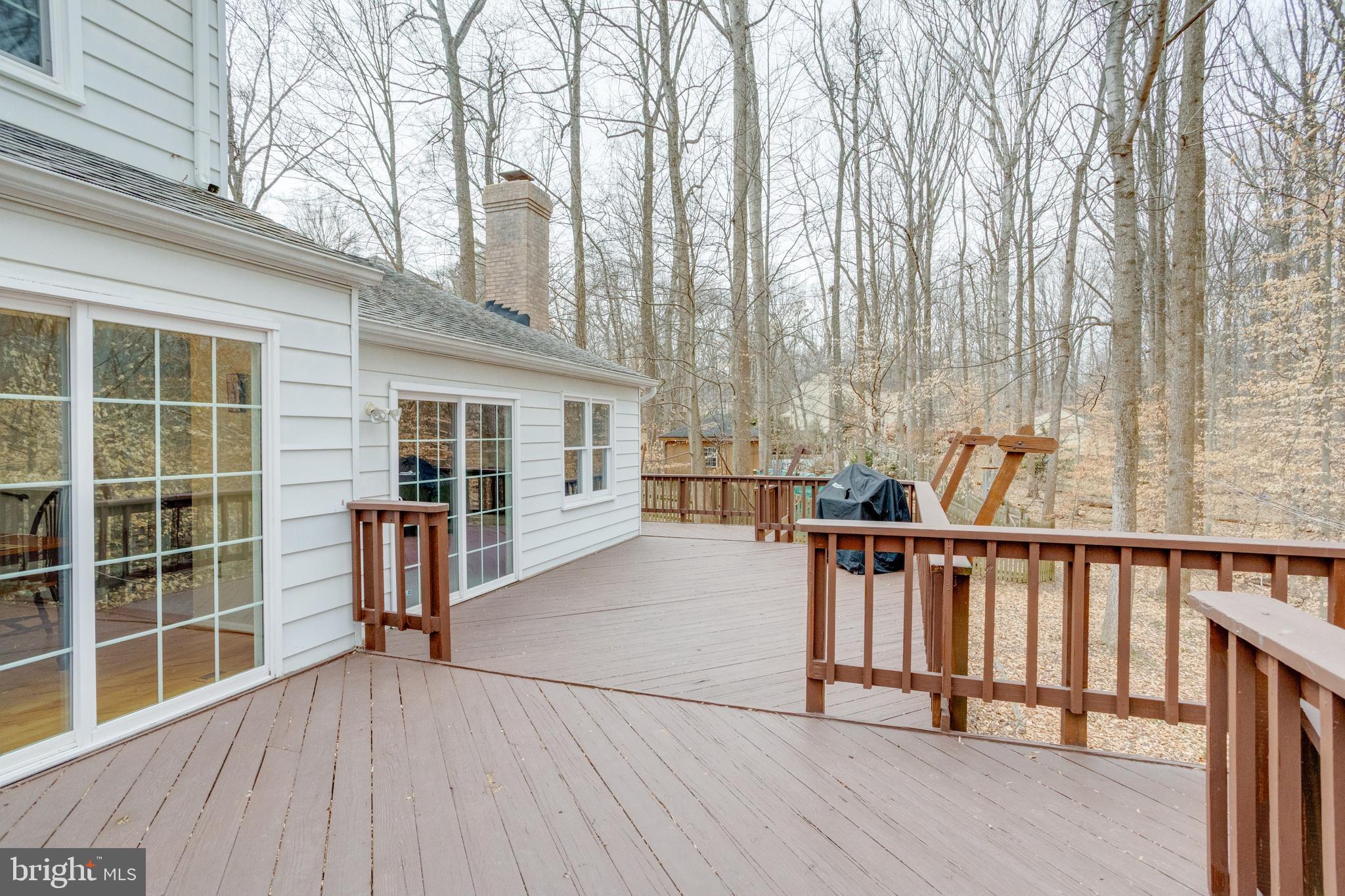 11316 Robert Carter Road Fairfax Station, VA 22039 - Photo 53 of 56 a view of a balcony with chairs and wooden floor