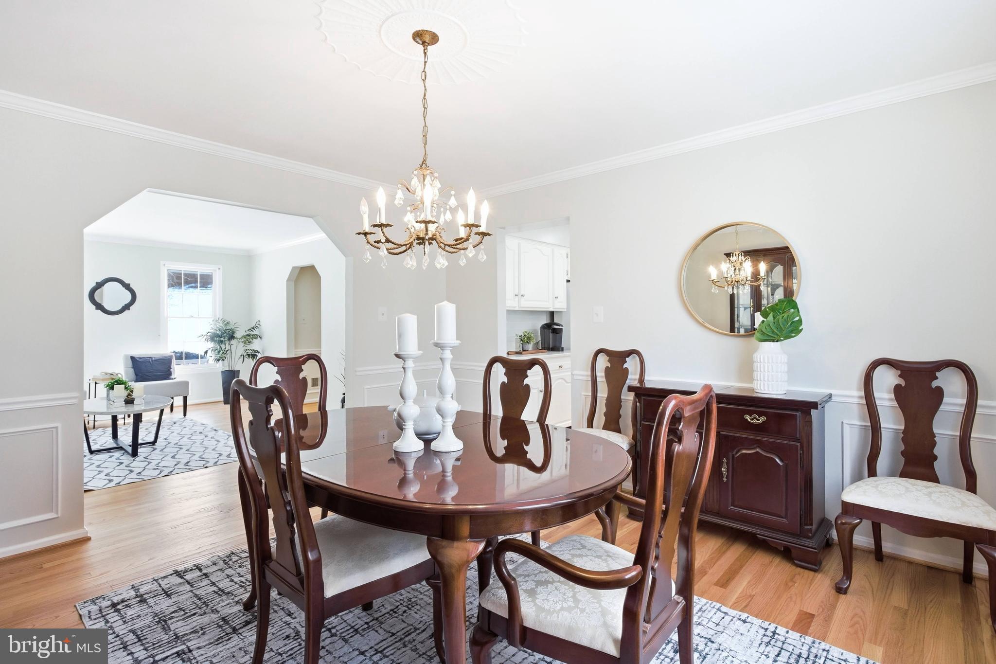 11316 Robert Carter Road Fairfax Station, VA 22039 - Photo 8 of 56 a view of a dining room with furniture wooden floor and chandelier